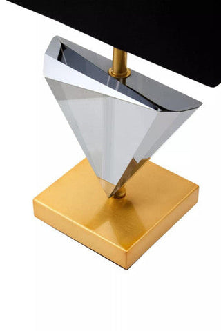 Halina smoked crystal table lamp with a sleek faceted smoked crystal shade and polished gold metal base