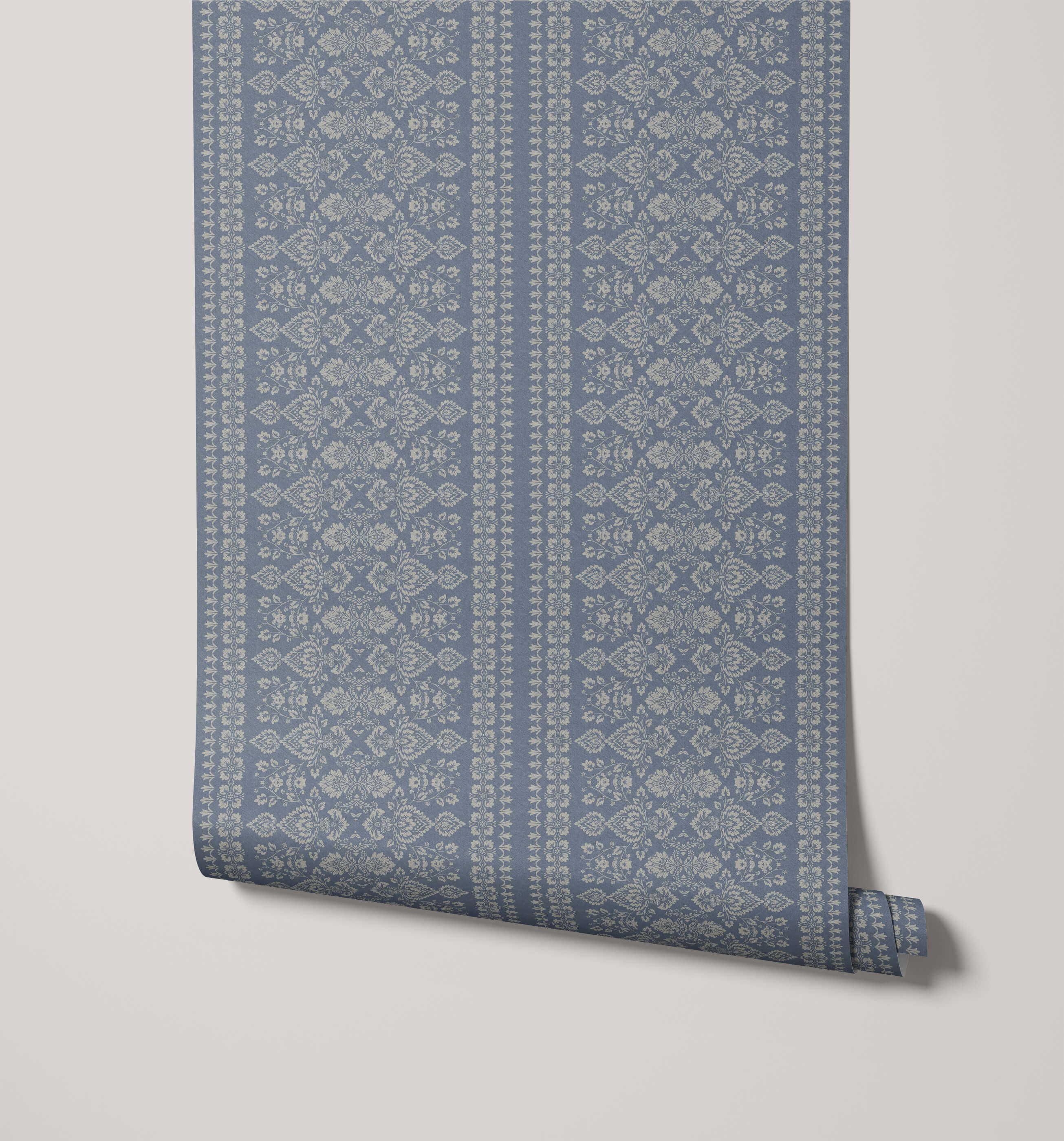 A roll of hallen blue damask floral stripe wallpaper with an intricate repeating pattern in a lighter shade