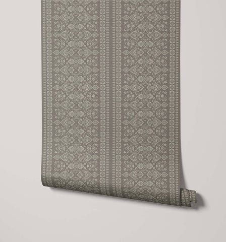 A roll of hallen sage green damask floral wallpaper with intricate lighter gray repeating floral stripe pattern