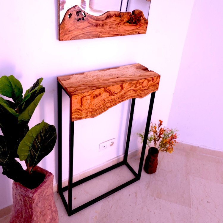 Rustic console table with a live-edge olive wood top and black metal frame for a stylish hallway setup sustainably sourced
