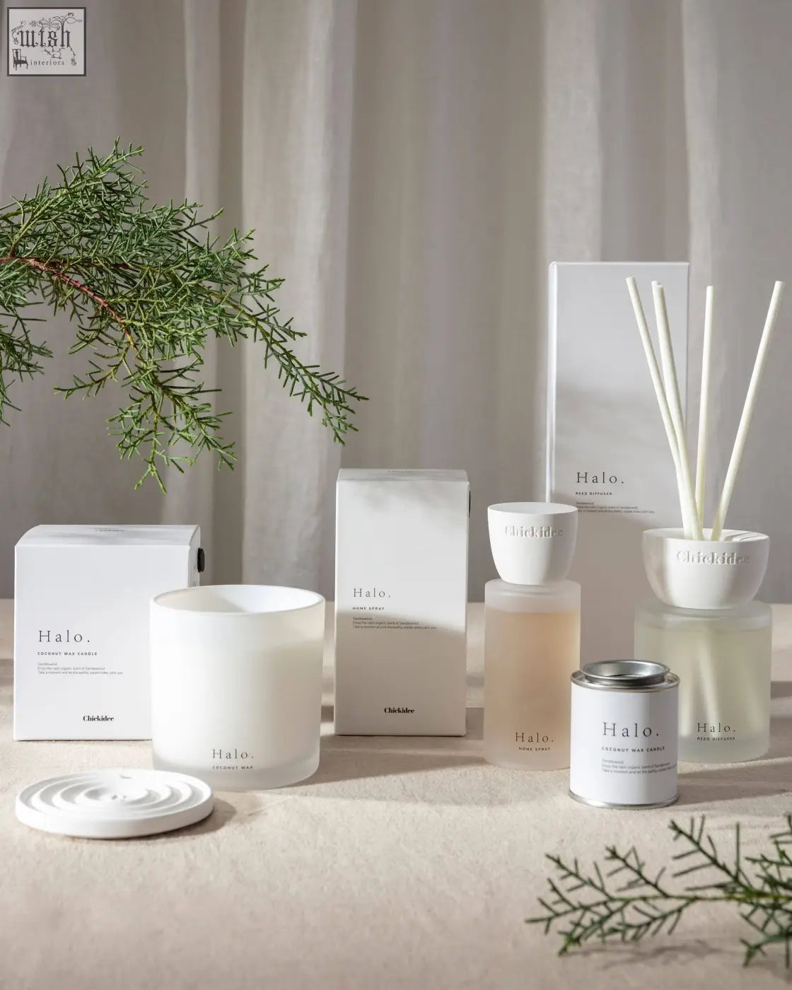 White frosted glass candle with minimalist halo branding for halo clay home spray with warm base scent