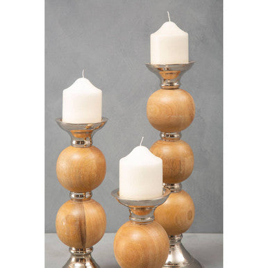 Three tiered hampstead medium pillar candle holder with stacked wooden spheres silver accents and white pillar candles