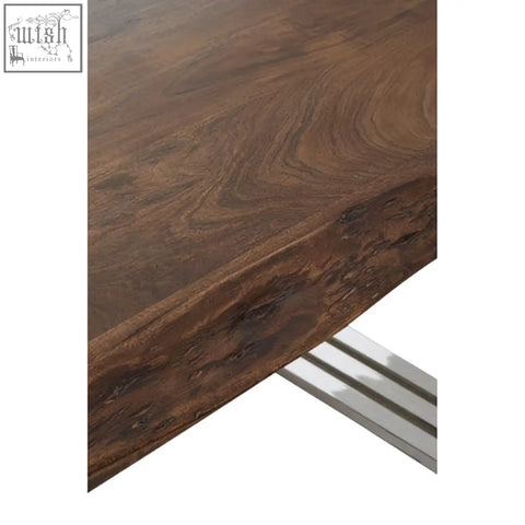 Dark brown wooden dining table with live edge and sleek silver dining table legs in hampstead natural and silver style