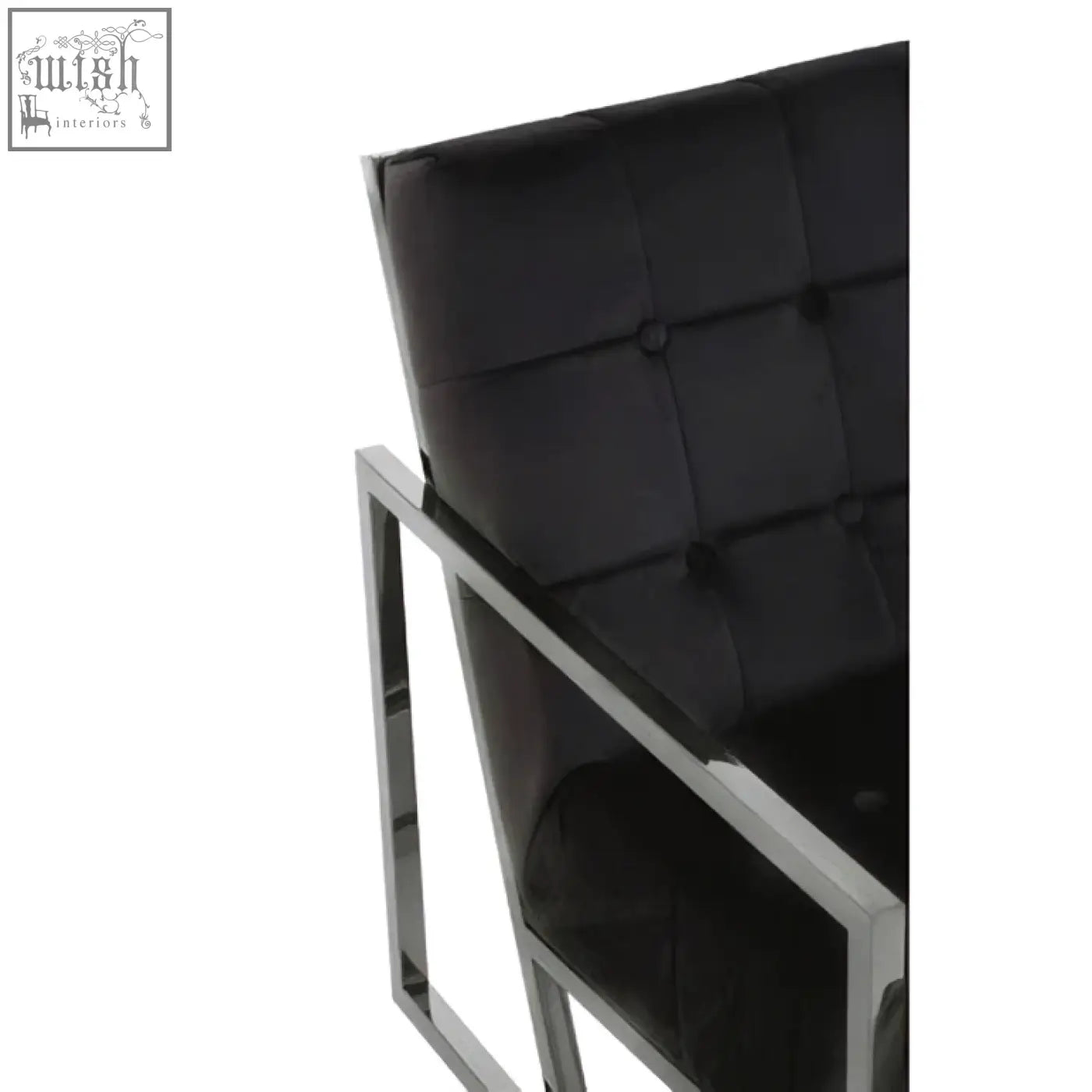 Black tufted velvet chair with sleek stainless steel frame perfect for modern living spaces