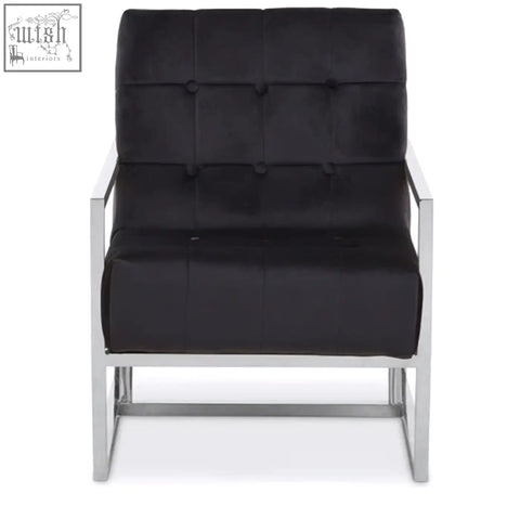 Black tufted velvet chair with sleek chrome stainless steel frame perfect for stylish living spaces