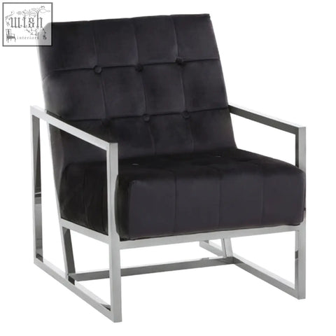Black tufted velvet chair with a sleek stainless steel frame for modern stylish seating