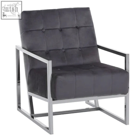 Modern black tufted armchair with sleek stainless steel frame and steel frame for stylish living spaces