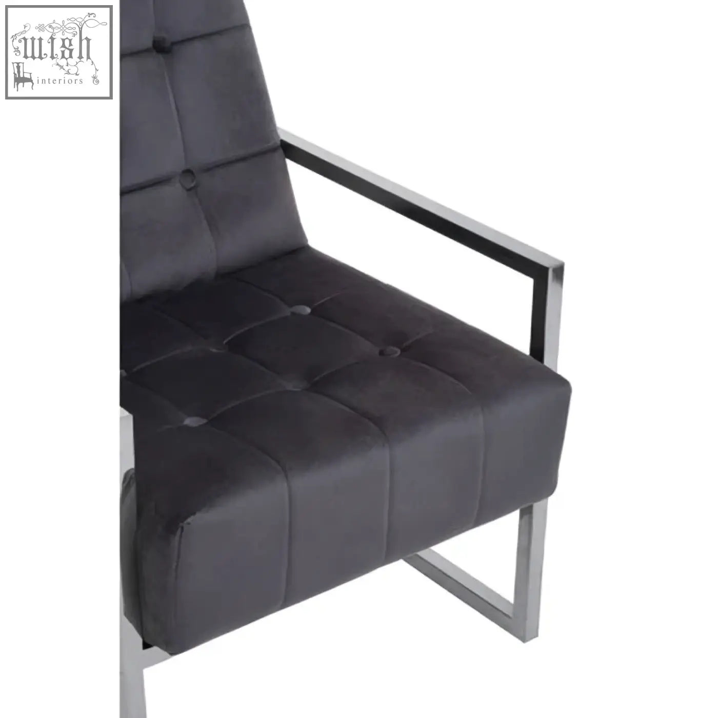 Black tufted leather armchair with a sleek stainless steel frame perfect for modern living spaces