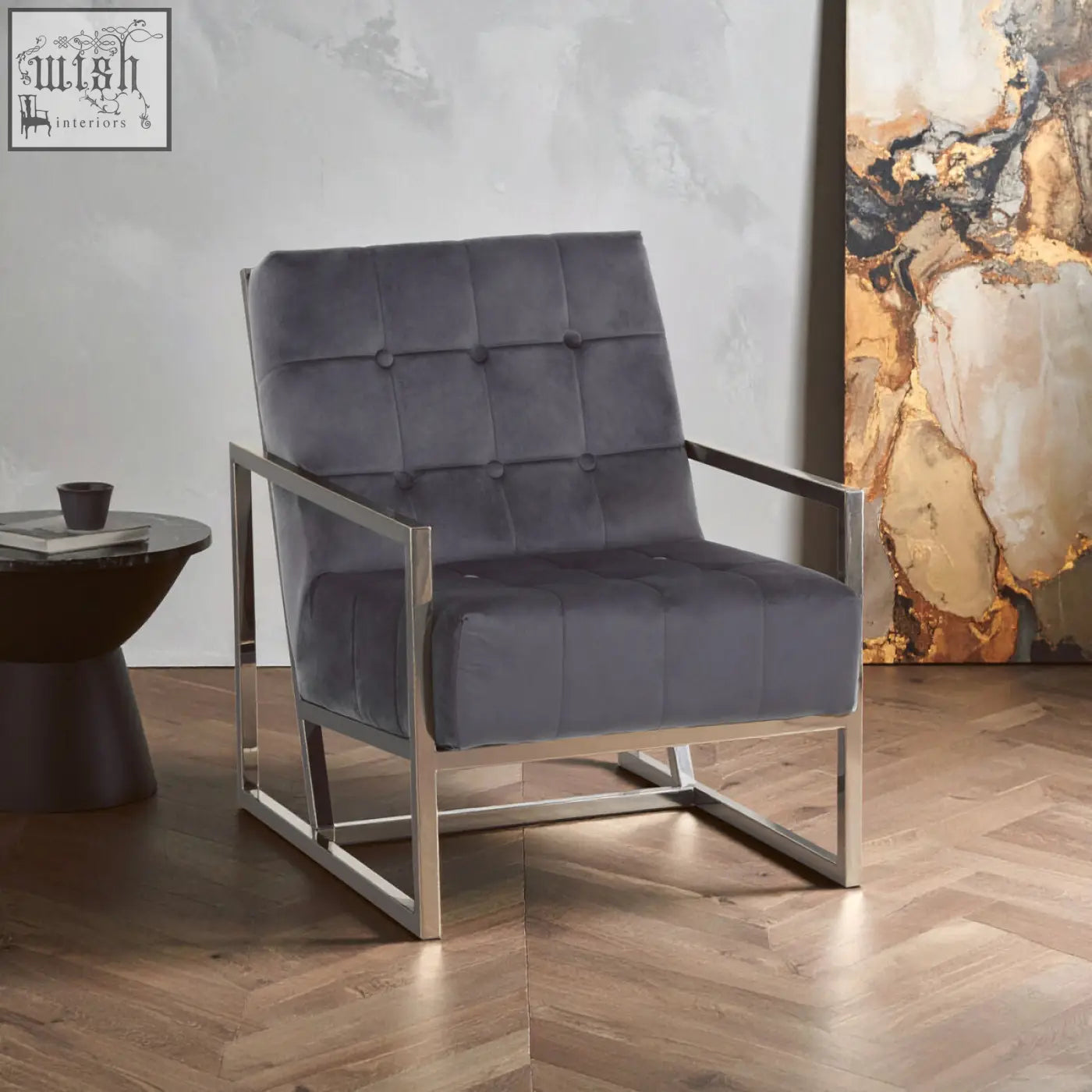 Hana grey velvet chair with tufted upholstery and sleek stainless steel frame for modern living spaces