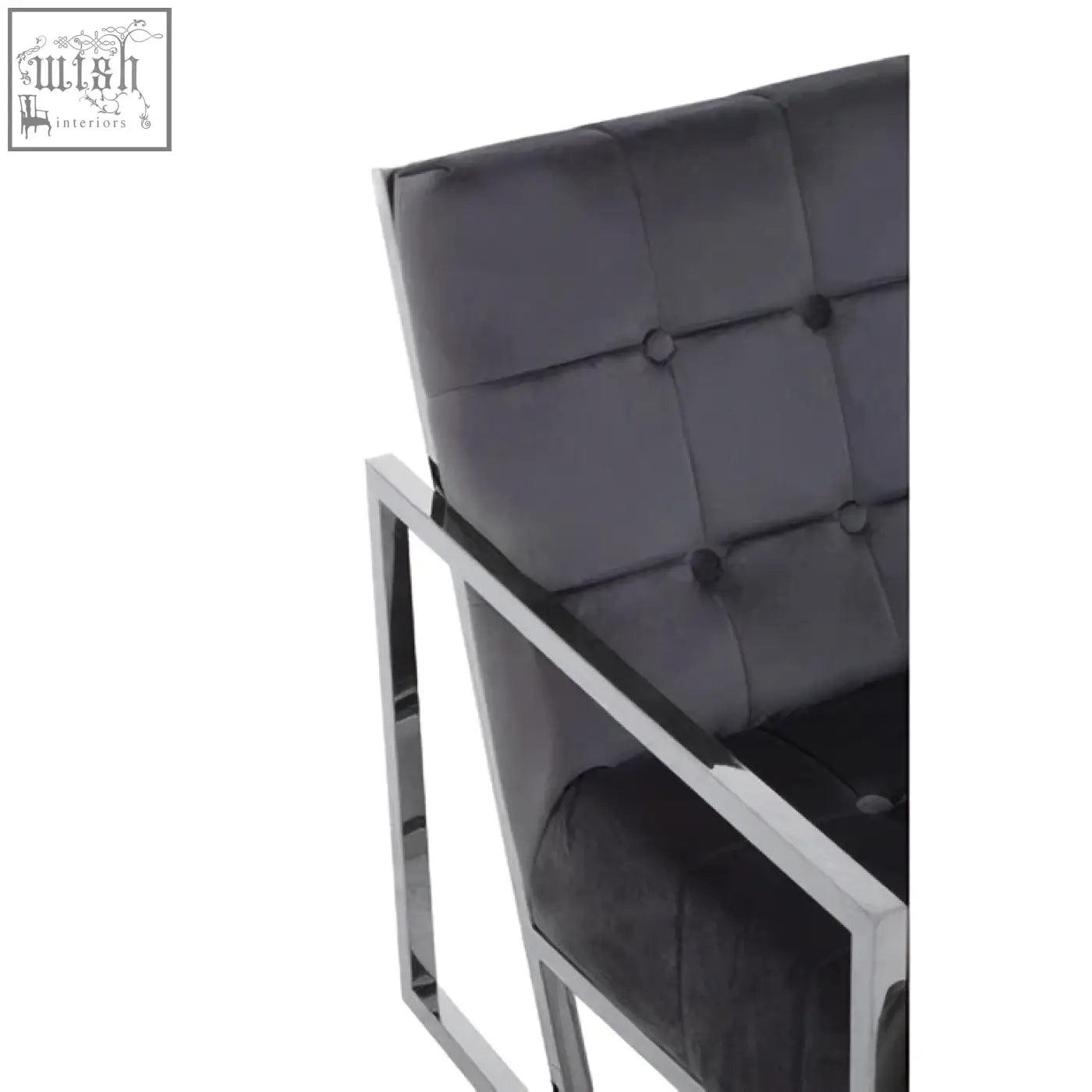 Black tufted velvet armchair with sleek stainless steel frame perfect for stylish living spaces