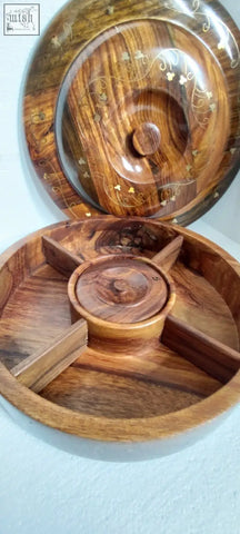 A hand crafted sasswood round fruit serving tray with gold floral inlay and four compartments for dry fruit serving
