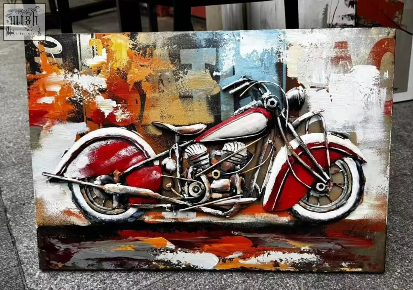 Handcrafted 3D metal wall art of a vibrant red and white motorcycle on a bold textured abstract urban metal wall background