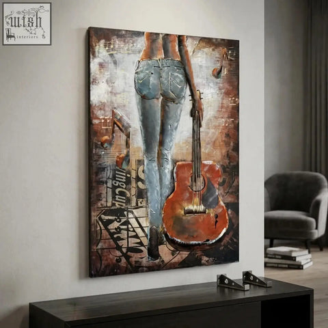 Handcrafted woman with guitar back view 3d metal wall art showing a figure in denim jeans holding an orange guitar on a musical wall art background