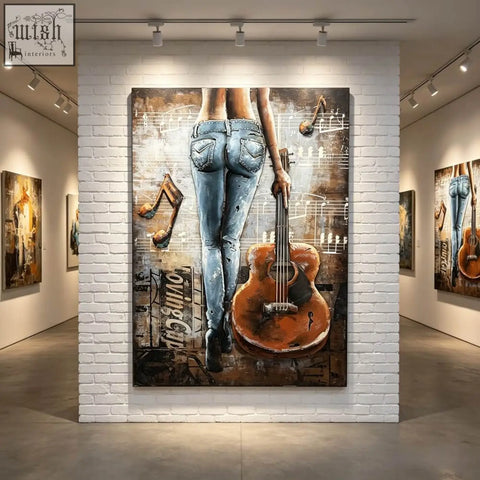 Vibrant handcrafted metal wall art showing the back of a woman in blue jeans holding an orange guitar for living room decor