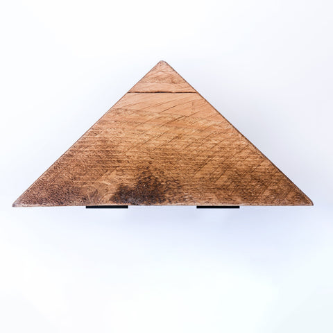 A rustic handmade bespoke corner shelf with warm brown wood grain and sturdy steel brackets and fixtures