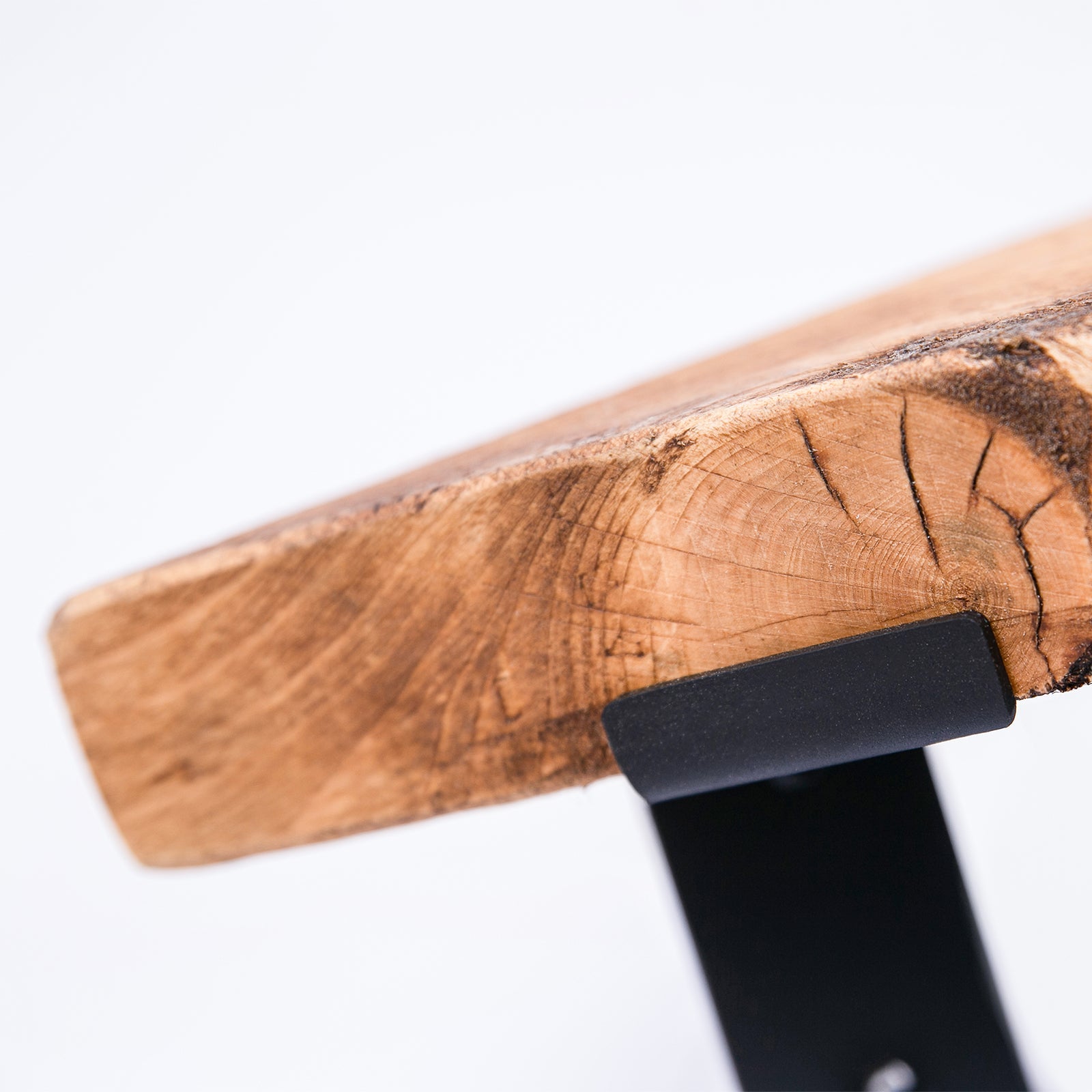 Handmade bespoke corner shelf with rustic wooden live edge top and black steel brackets for sturdy support