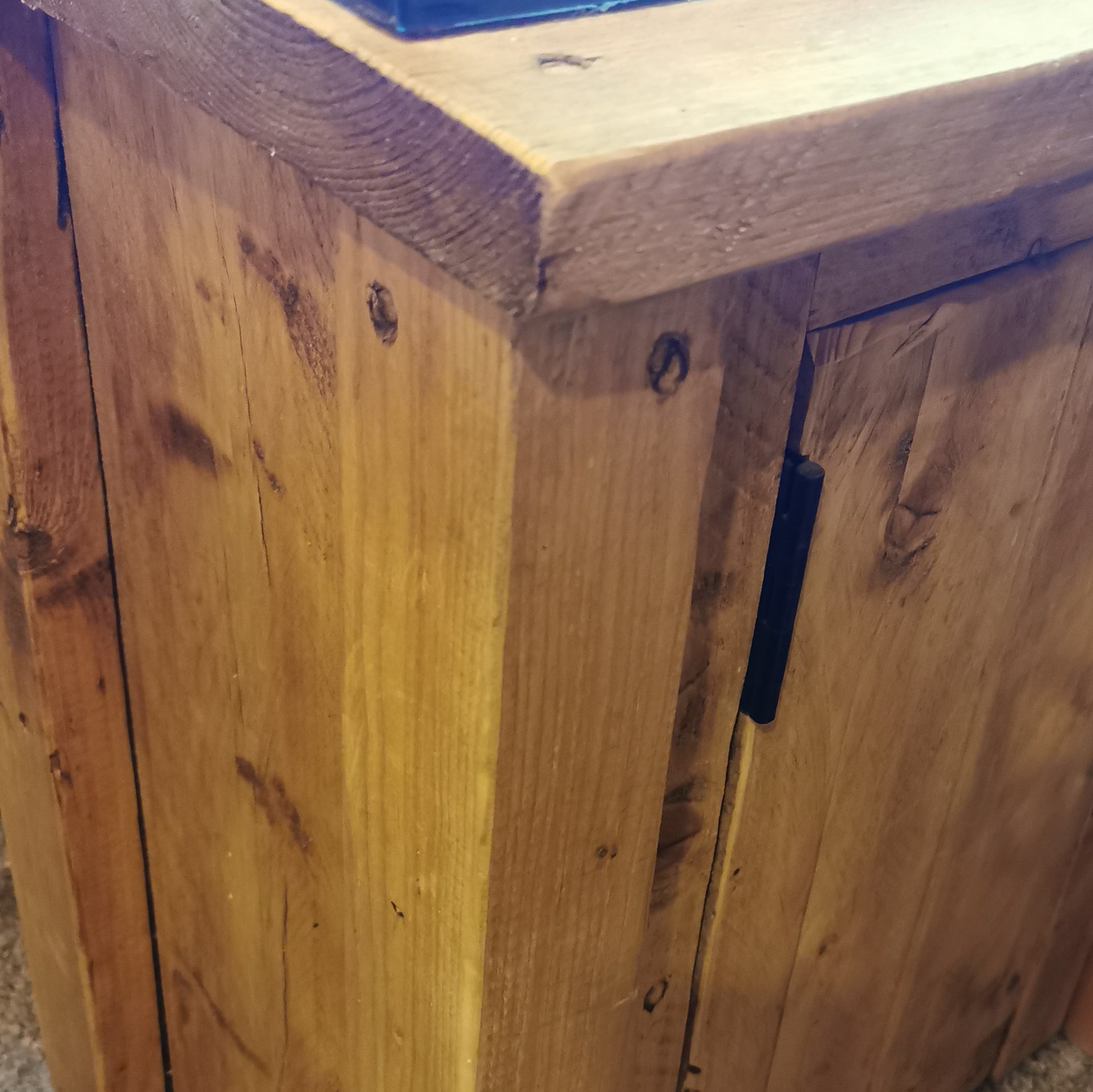 Rustic wooden fish tank stand with natural knots and dark metal hinge in custom sizes and colours