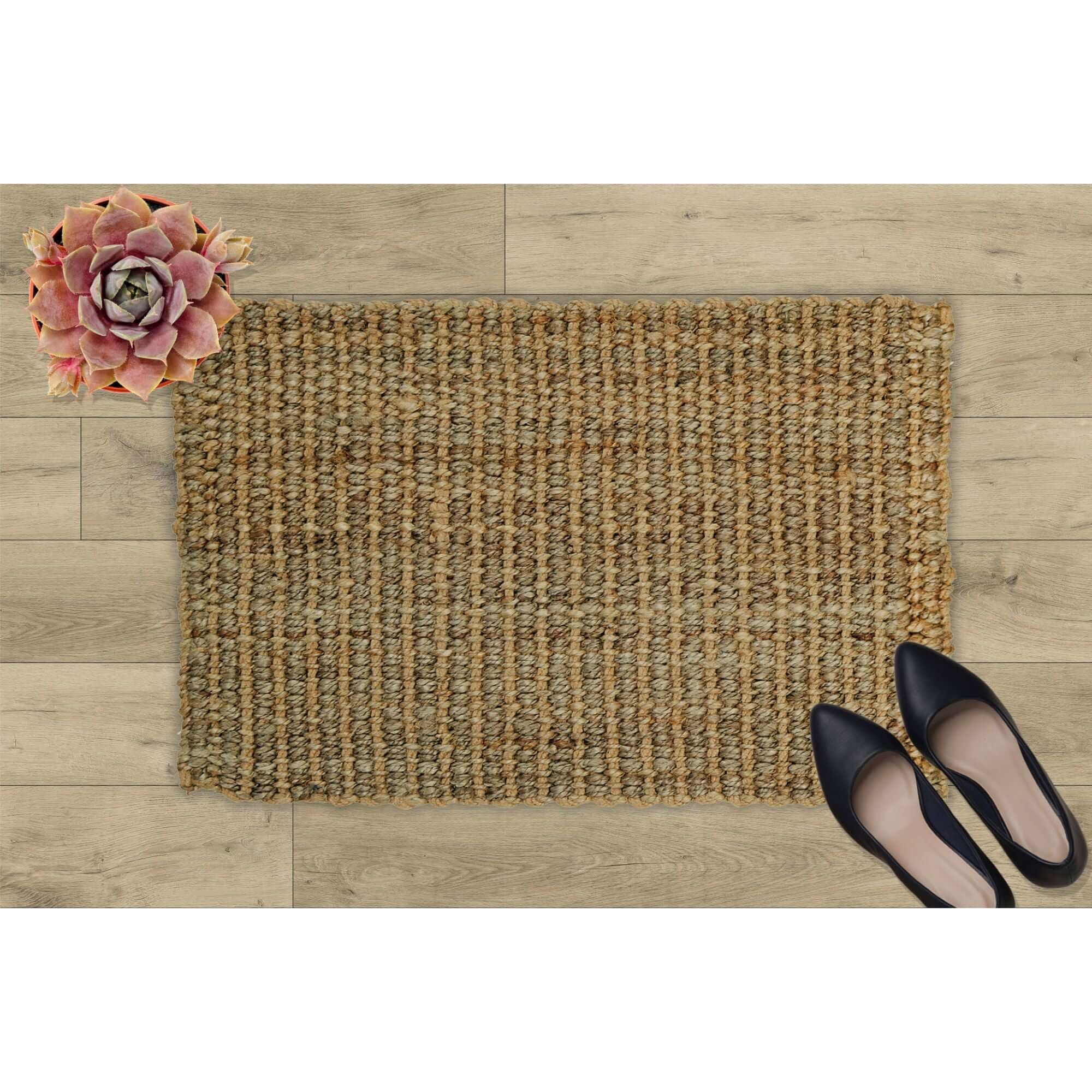 Handmade natural jute rug with a textured beige brown surface woven from natural jute fibers for indoor use