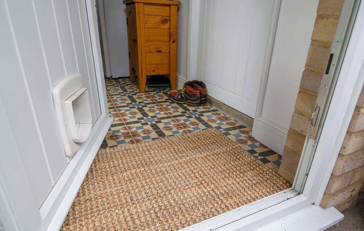 Handmade natural jute rug with a textured light brown surface made of natural jute fibers
