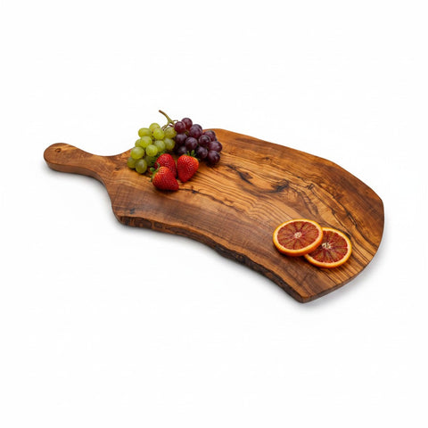 Handmade olive wood serving board with live bark edge and natural grain perfect for rustic charcuterie use