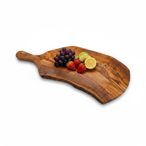 Handmade olive wood paddle board with live bark edge and natural grain perfect for rustic charcuterie serving