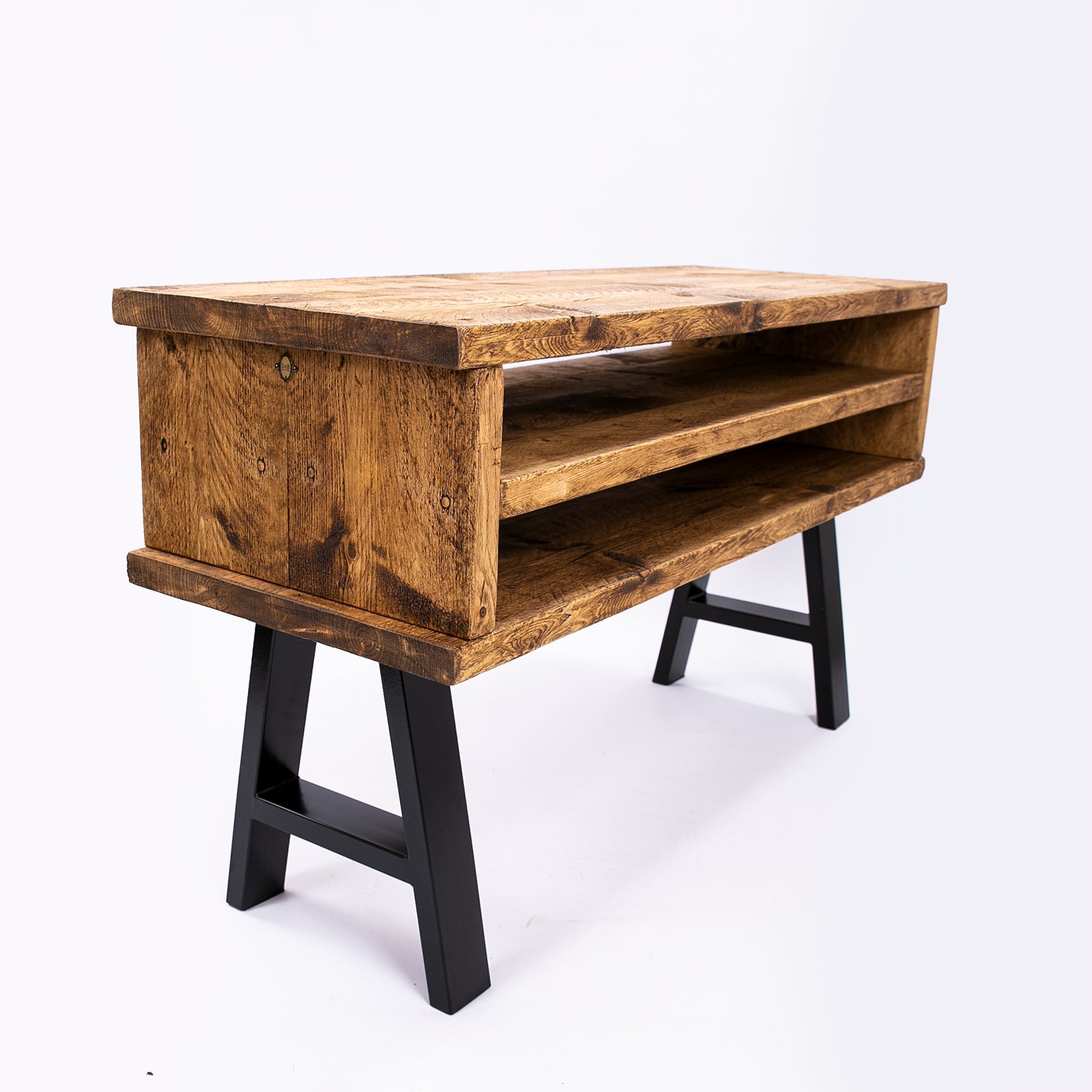 Handmade rustic tv stand with black metal legs and two open shelves made of wood for cozy living spaces