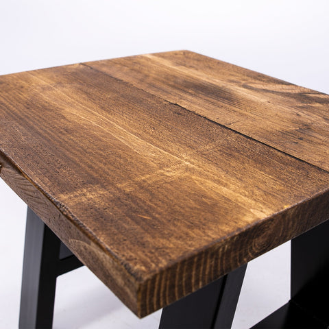 Rustic brown handmade solid wooden stool top showing natural wood grain and texture with steel legs visible