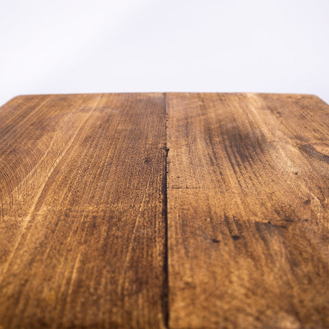 Handmade solid wooden stool featuring a warm-toned cutting board top with natural grain and visible plank joinery