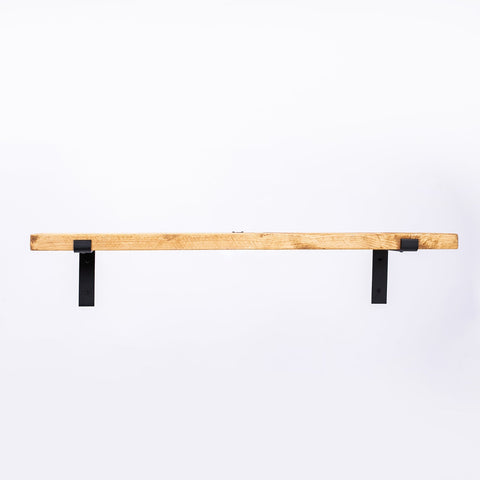 Handmade light-colored wooden shelf with black steel brackets from cheshire workshop with custom finish and free uk delivery