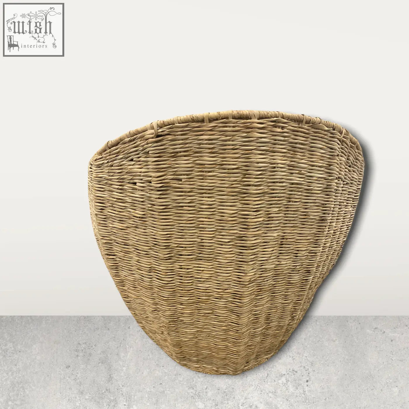 Natural woven wicker palm leaf chair with tapered rounded shape and tight interlaced strands from mozambique
