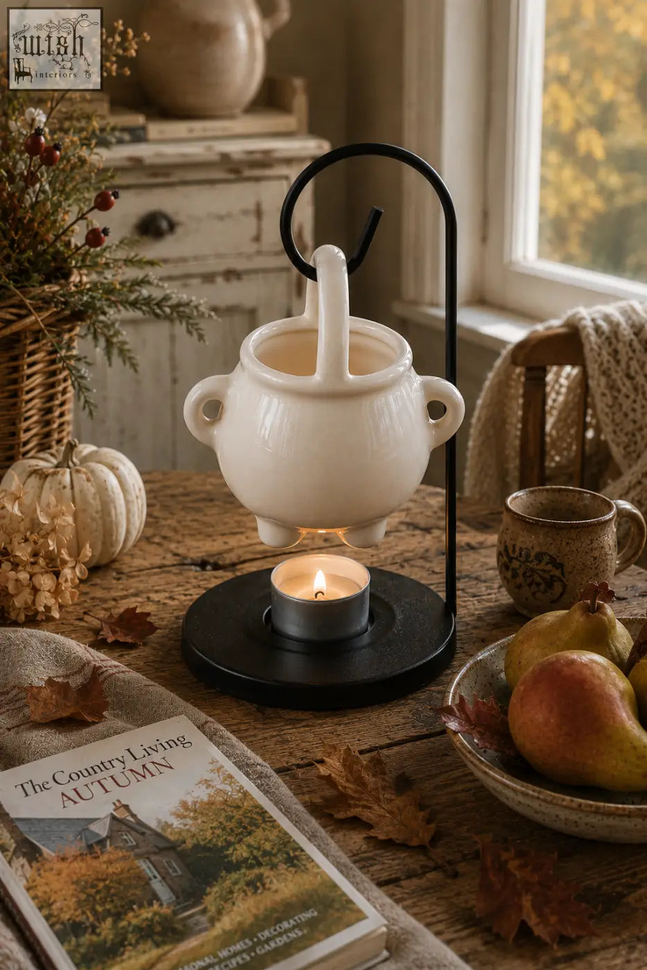 White ceramic wax melter with black metal stand and handles perfect for pumpkin spiced wax melts and spiced wax melts
