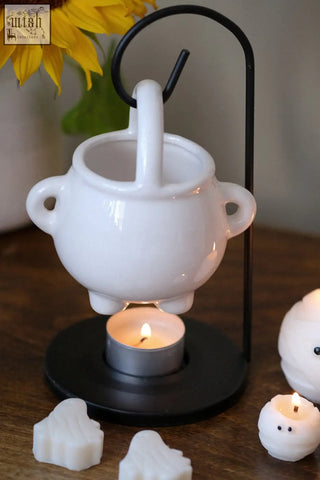 White ceramic hanging cauldron oil diffuser with handles and tealight base for pumpkin spiced wax melts