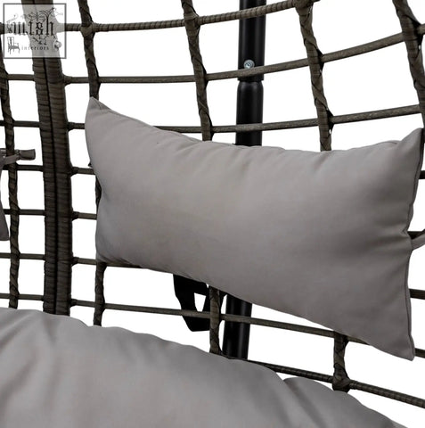 Gray rectangular cushion with soft fabric texture on woven rattan frame of hanging swing egg sofa with power coated steel frame