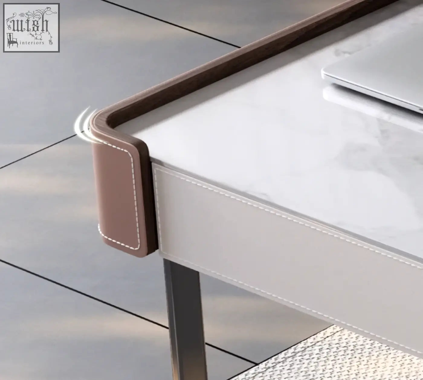 Brown leather corner protector with white stitching on hank office desk sintered stone for stylish home office use