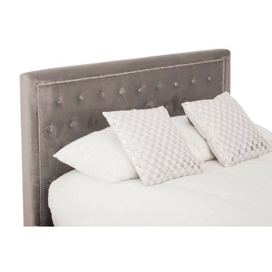 Gray tufted velvet headboard with silver nailhead trim on the hannah grey ottoman king bed