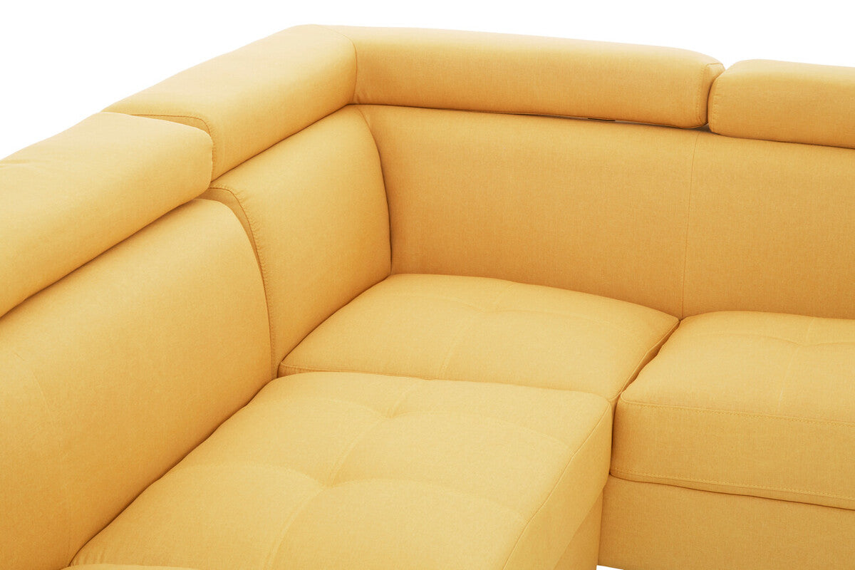 Cream-colored leather sectional sofa with tufted cushions and clean modern lines in hanover ochre linen style