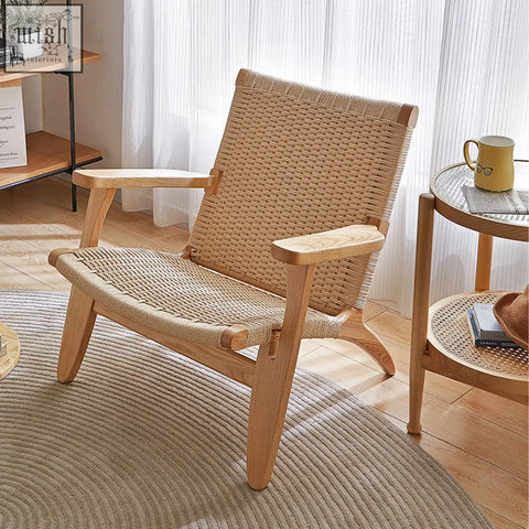 Hans ch25 oak armchair with oiled oak frame and woven natural fiber seat and backrest designed for lounging
