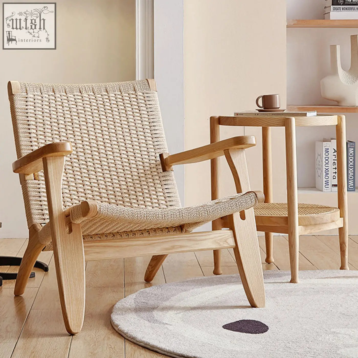 Hans ch25 oak armchair designed with an oiled oak frame and woven natural fiber seat and backrest