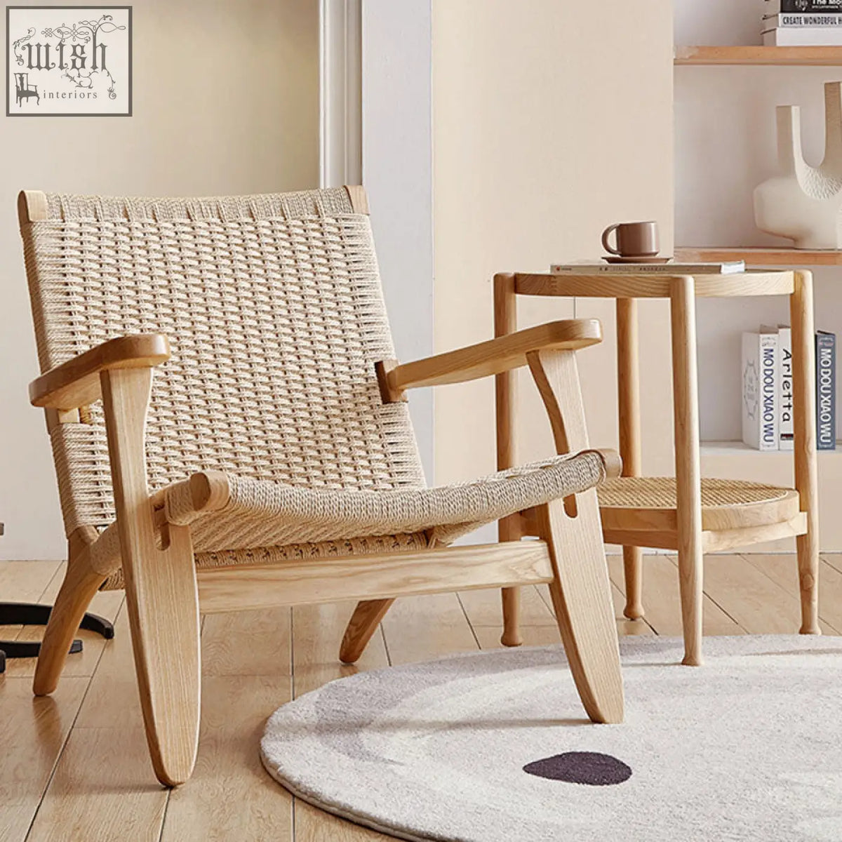 Hans ch25 oak armchair designed with an oiled oak frame and woven natural fiber seat and backrest