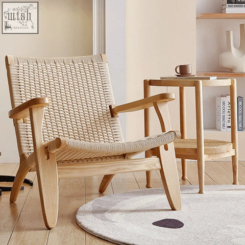 Hans ch25 oak armchair designed with an oiled oak frame and woven natural fiber seat and backrest