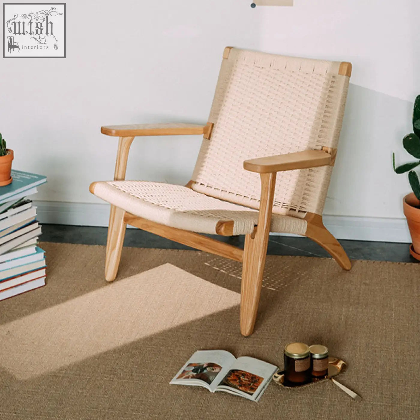 A hans ch25 oak armchair with a light oiled oak frame and woven natural cord seat and backrest