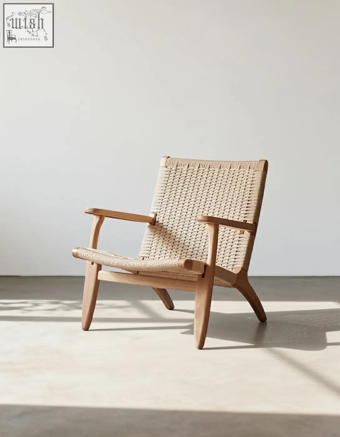 Hans ch25 oak armchair designed with oiled oak frame and natural woven cord seat and backrest in beige
