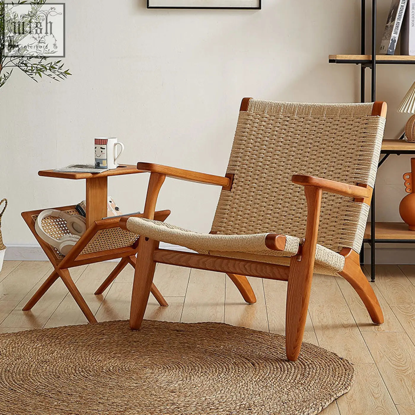 Hans ch25 oak armchair designed with a woven natural fiber seat and oiled oak frame with curved legs