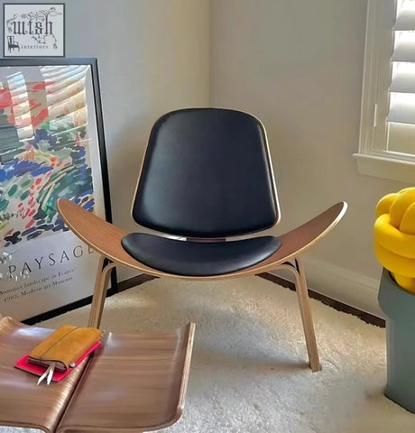 Mid-century modern hans wegner ch07 shell chair with black leather seat and light walnut wood frame