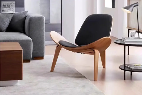 Hans Wegner ch07 shell chair with black upholstered seat and backrest and walnut wooden frame in mid-century modern style
