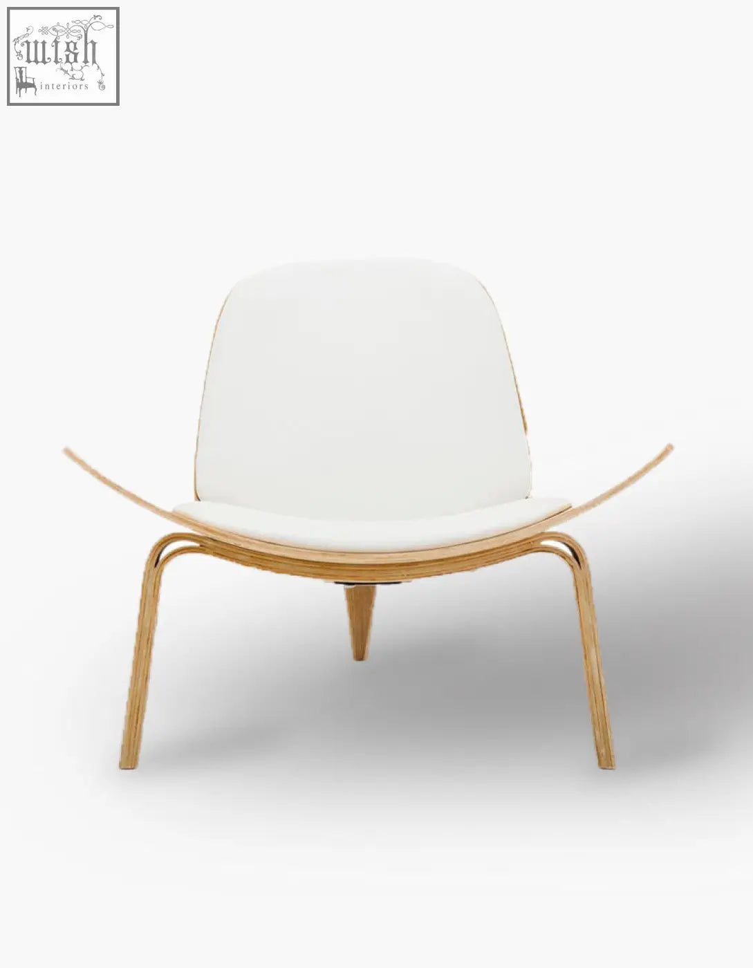 A hans wegner ch07 shell chair with sleek white upholstery and curved oak frame with tapered legs