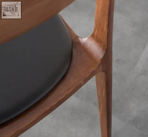 Hans wegner ch3 dining chair with sleek light brown wooden frame and dark gray upholstered seat in dark oak finish