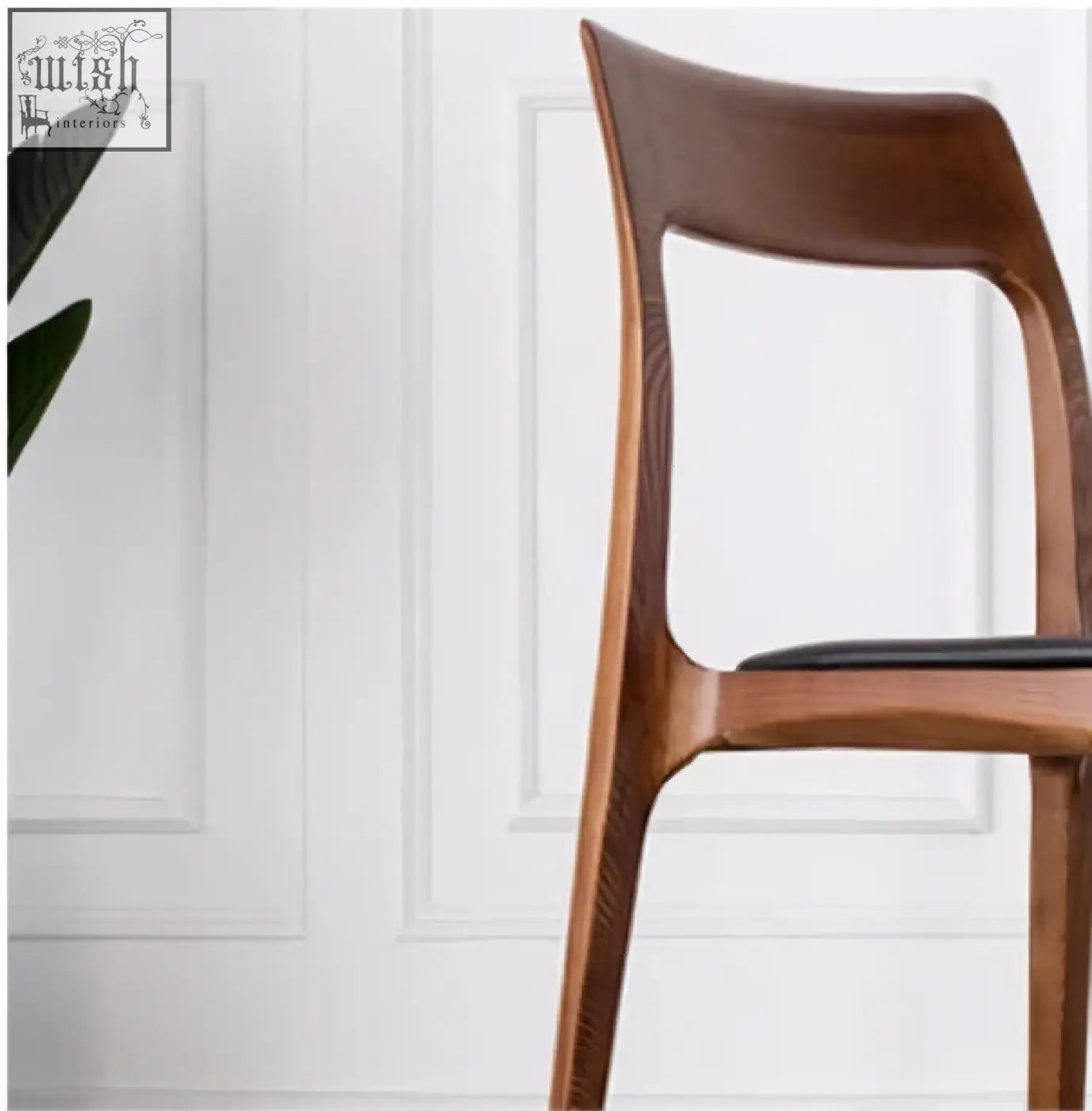 A hans wegner ch3 dining chair in dark oak with a sleek wooden frame and black upholstered seat perfect for dining chairs