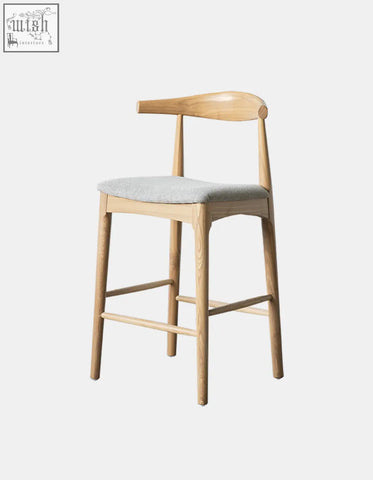 Light wood hans wegner ch32 bar stool with curved backrest and gray upholstered linen seat oak rosewood