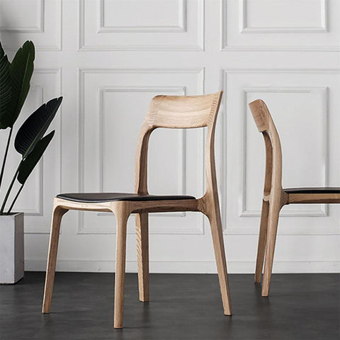 Modern hansel ch3 solid wood dining chair in dark oak with light wood frame and black upholstered seat